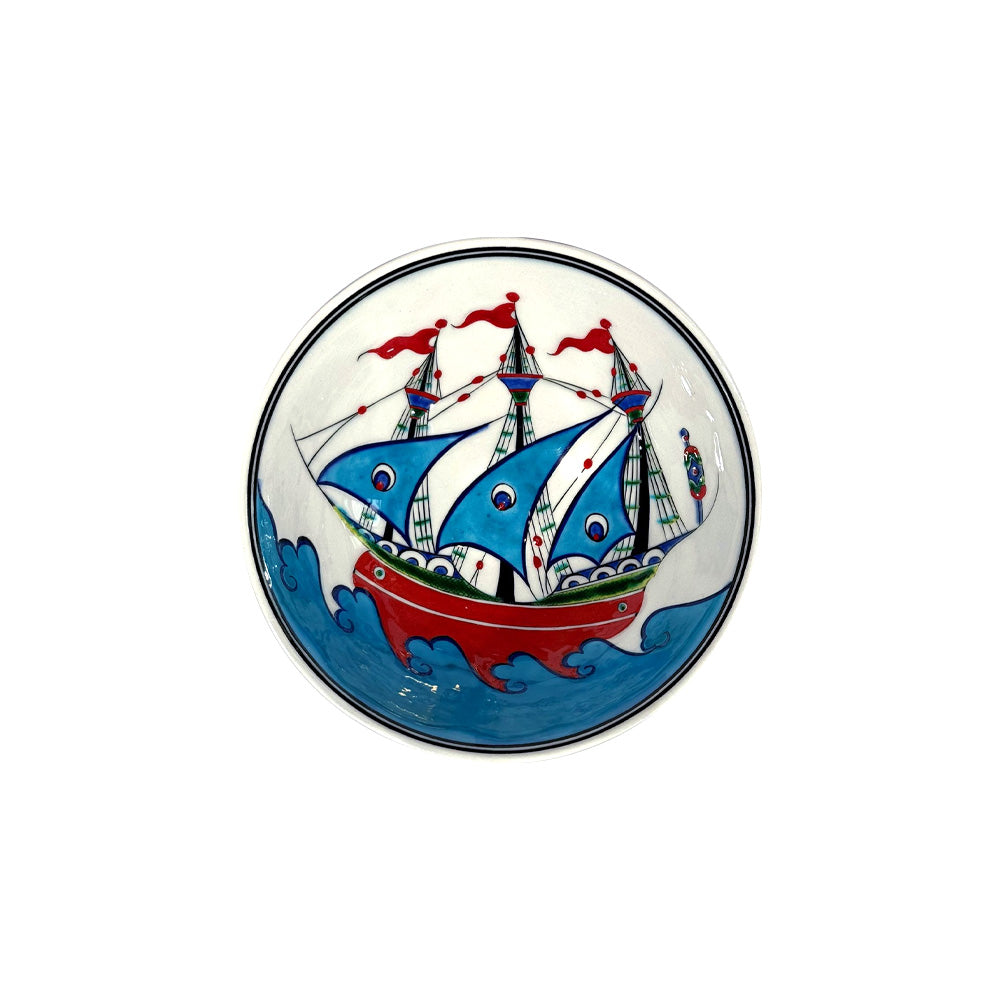 Decorative iznik bowl with a colorful ship design on a white background