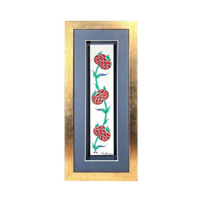 Iznik framed tile with red pomegranates.