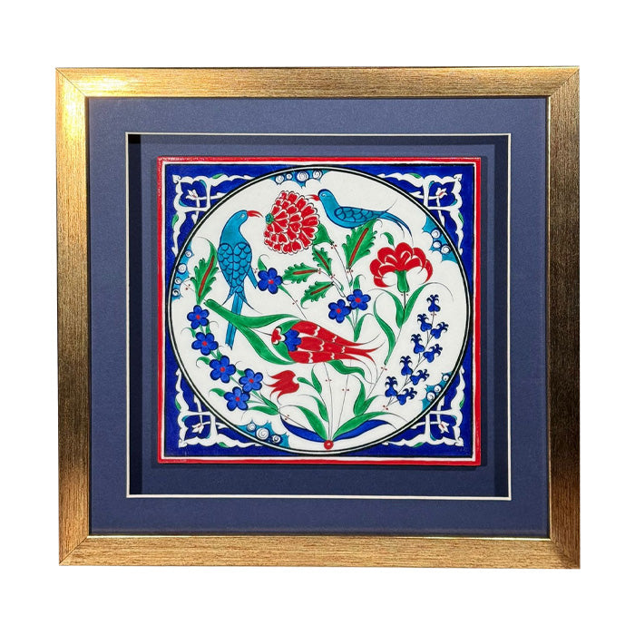 Decorative tile with birds and flowers in a gold frame