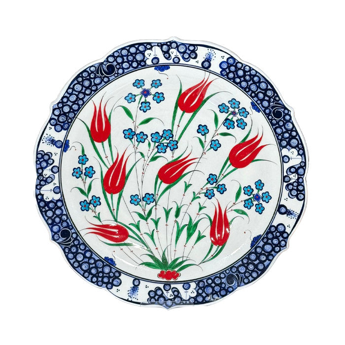 Iznik plate, penc flowers rising around coral red tulips.