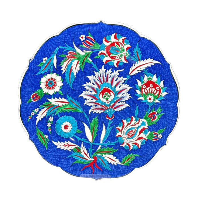 Iznik plate with awesome flower decorations around the sycamore leaf rising to the center.