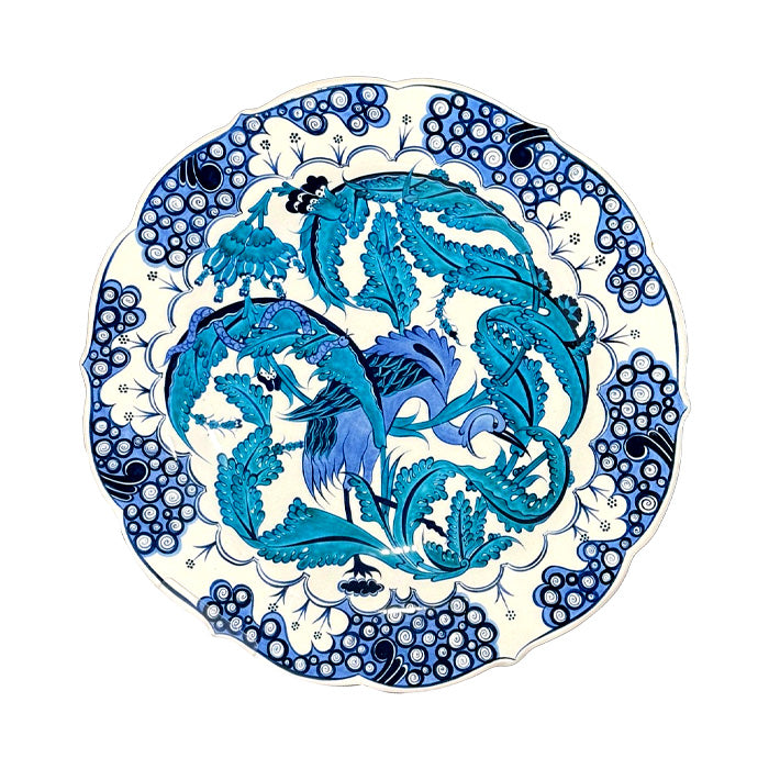 Iznik plate with&amp;nbsp; snake wrapped in turquoise dagger leaves, a dark blue stork in the middle.