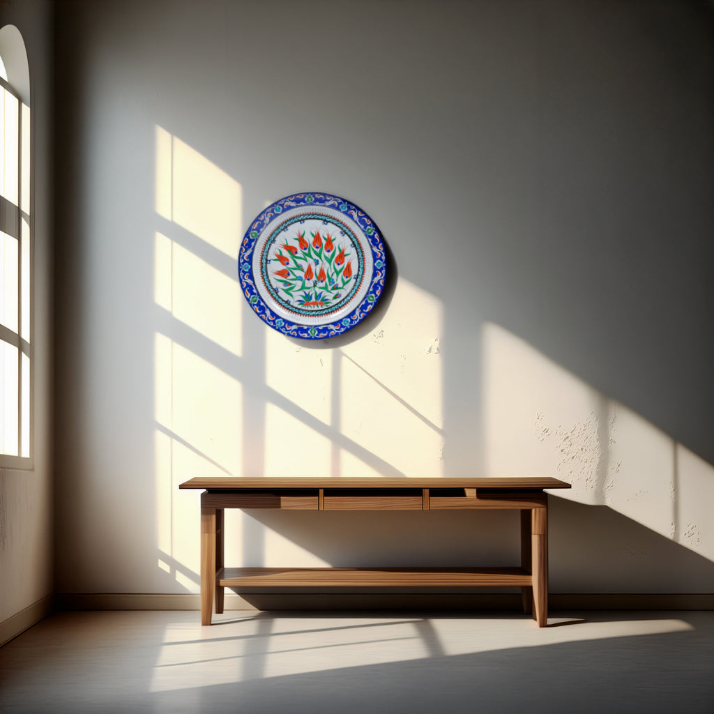 Decorative Iznik plate with floral design on a wall in a room with sunlight streaming through a window.