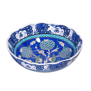 Iznik bowl decorated with pomegranate flowers in cobalt-blue ground