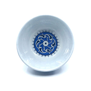 Iznik bowl blue-white rumi pattern on cobalt-blue ground.