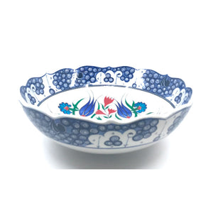 Iznik bowl decorated in floral stems with cobalt-blue tulips
