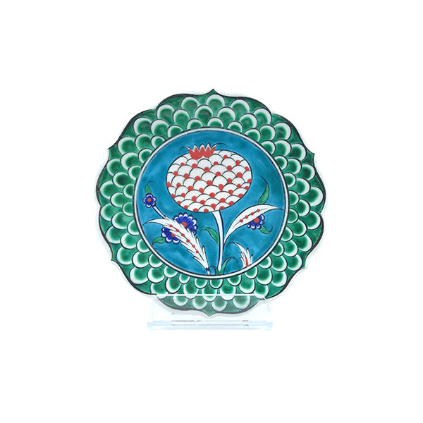 Iznik plate decorated with pomegranate flower on turquoise ground