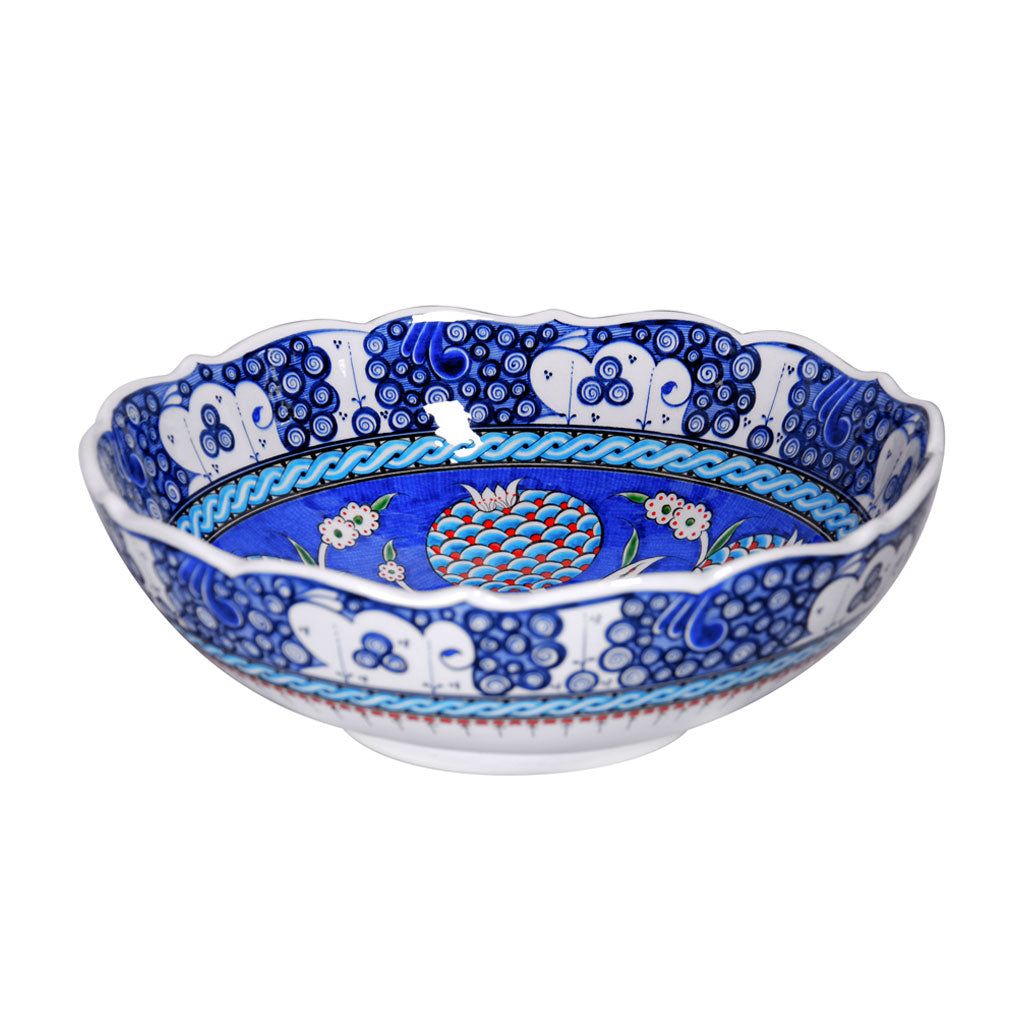 Iznik bowl decorated with pomegranate flowers in cobalt-blue ground