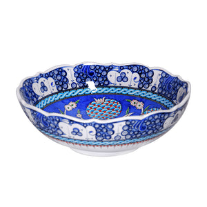 Iznik bowl decorated with pomegranate flowers in cobalt-blue ground