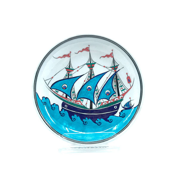 Iznik deep dish decorated with blue ship design