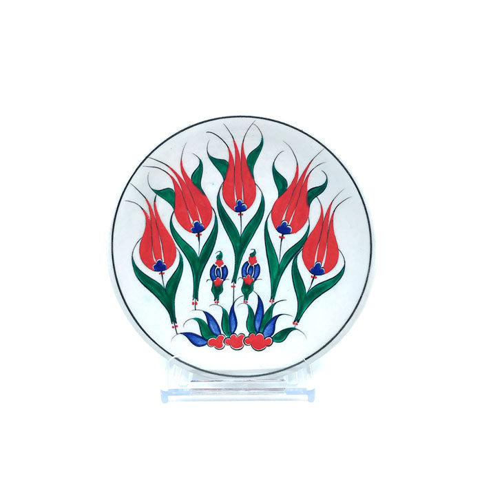 Iznik plate with green branches and five red tulips rising